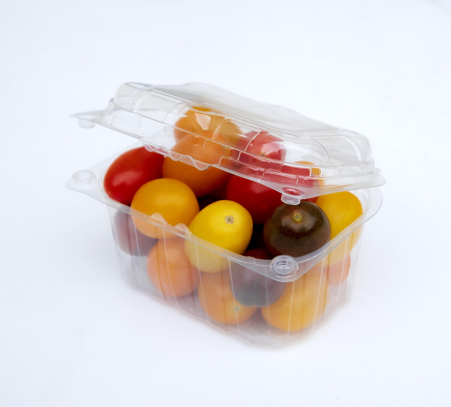 Clear plastic package with cherry tomatoes in it.